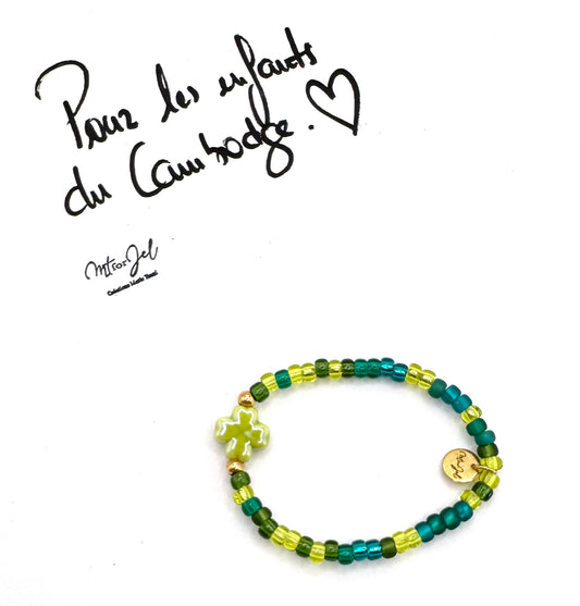 Capsule humanitaire pour les enfants du Cambodge.

Bracelet élastique pour les grandes et les petites - Perle trèfle en céramique vert - Perles de rocaille.